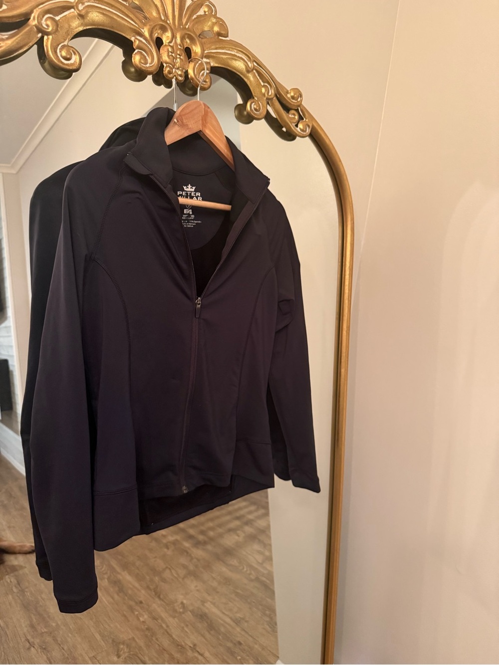Peter Millar black zip up with Octagon logo on sleeve